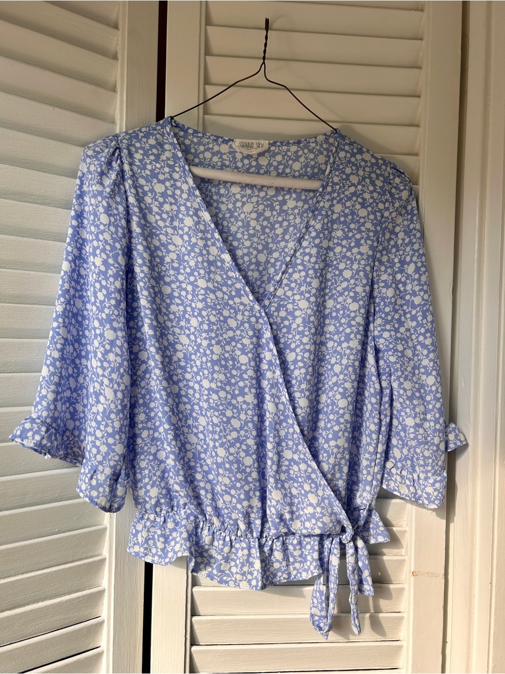 Sienna Sky Light Blue Floral Wrap Blouse